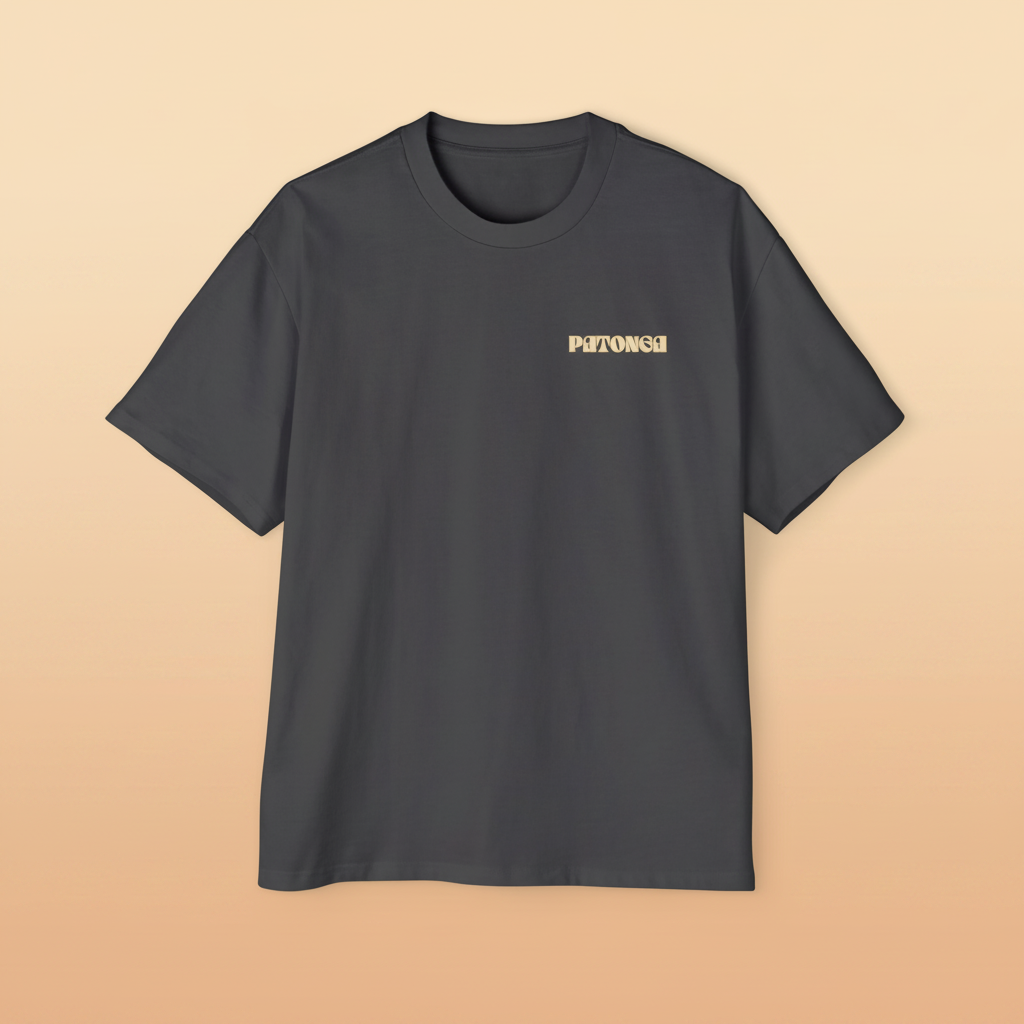 Long Way Round tee — flat lay front view, orange chest mark on charcoal