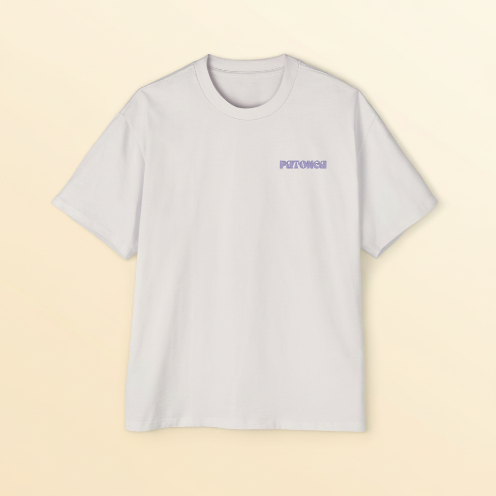 Sand Daze tee — flat lay front view, yellow chest mark on natural